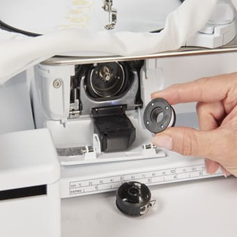 Front load Jumbo bobbin for easy re-threading